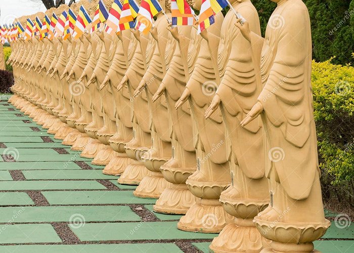 Buddhist Temple Many Buddha Statues in Perspective at the Buddhist Temple ... photo